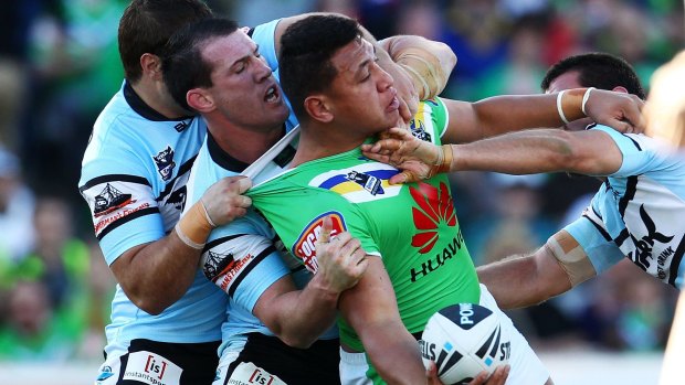 Old sparring partners: Paul Gallen tackles Josh Papalii during the 2012 NRL finals.