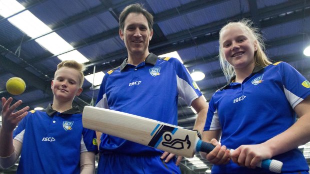 Cricket Australia CEO James Sutherland with Lauren Phillips (15) and Matt Phillips (12) in Canberra during Play Cricket Week.