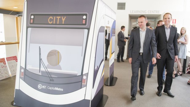 ACT Chief Minister Andrew Barr and Minister for Capital Metro Simon Corbell inspect a model of the tram.