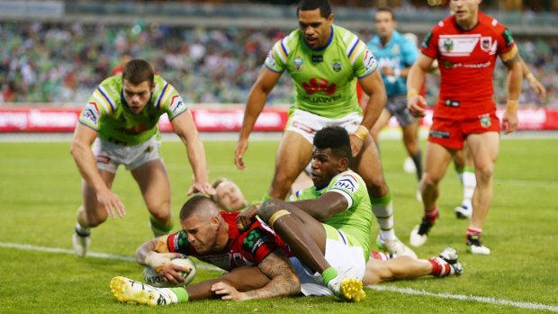 Former Raider Joel Thompson scores the match-winning try for the Dragons.