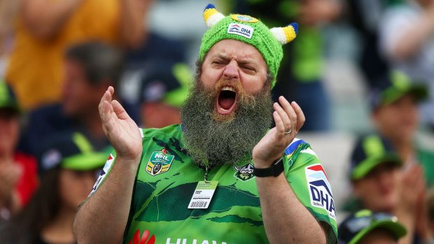 A Canberra Raiders fan cheers on the Green Machine during last weekend's clash against the Tigers in Canberra.