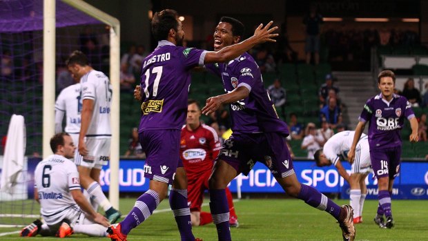 Perth Glory's Diego Castro celebrates with teammate Jamal Reiners after scoring what turned out to be the only goal of the match against Melbourne Victory.