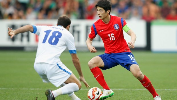 No stranger: Ki Sung-yueng controls the ball against Uzbekistan. The South Korean captain spent part of his teenage years in Australia.