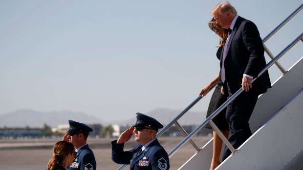 President Donald Trump and first lady Melania Trump arrive in Las Vegas.