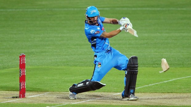 Smashed it: Jono Dean's bat splits in two as he connects with a shot in the Strikers' victory over the Hurricanes.