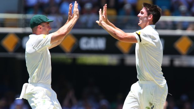 Mitch Marsh celebrates his first Test wicket with brother Shaun.