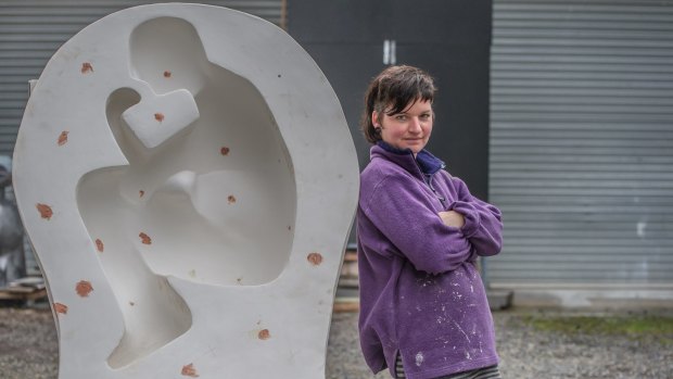Canberra sculptor Hanna Hoyne, whose work is being featured in Sculpture by the Sea at Bondi this year, working on her piece in her Mitchell workshop.
