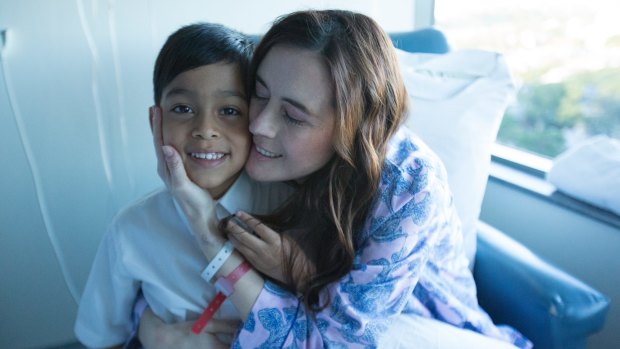 Patient Ana with her son in <i>Miracle Hospital</I>.