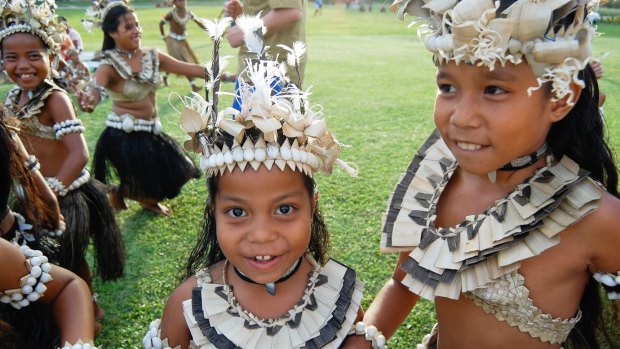 Local children participate in a Historical Village Dance, Fiji.