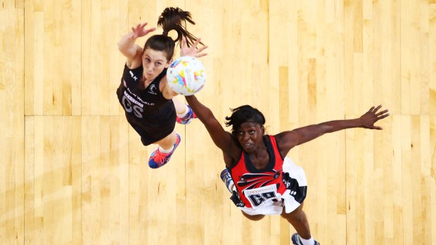 Game on: Bailey Mes of New Zealand competes with Kemba Duncan of Trinidad and Tobago on Saturday.