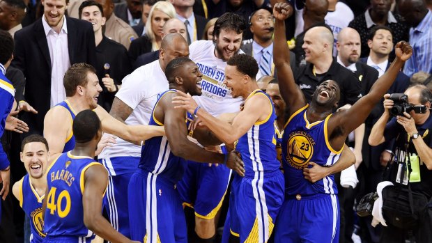 Jubilant Warriors players, including Australia's Andrew Bogut, celebrate the win.