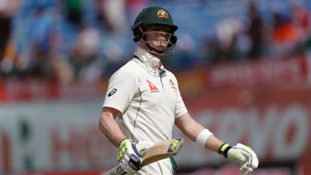 Australia's captain Steven Smith leaves ground after his dismissal for 111 by India's Ravichandran Ashwin during the first day of their fourth test cricket match in Dharmsala.