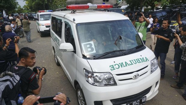 A convoy of ambulances carrying coffins make their way to Nusa Kambangan prison on January 17, a day before the scheduled execution of six prisoners convicted of drug offences.