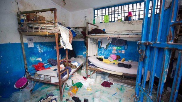 A prison cell is empty after inmates escaped from the Civil Prison in the coastal town of Arcahaiea, Haiti.