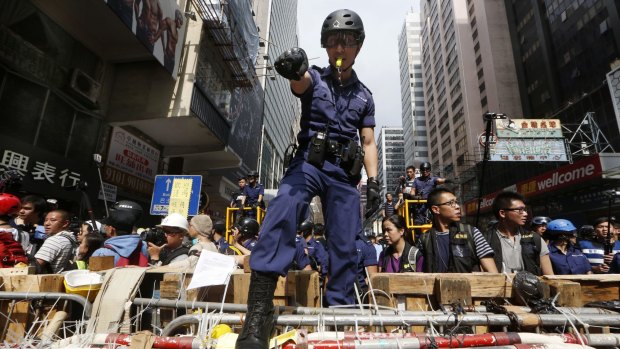 Police helped remove barricades at the Mong Kok protest site.