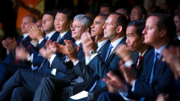 The G20 line-up applauds.