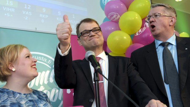 Juha Sipila signals his Centre Party victory in Finland's election.