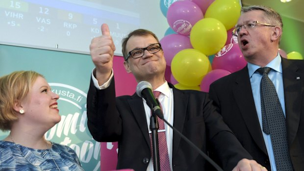 Juha Sipila signals his Centre Party victory in Finland's election.