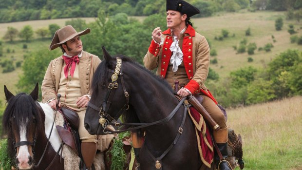 Gad as Lefou and Luke Evans as Gaston in Beauty and the Beast.
