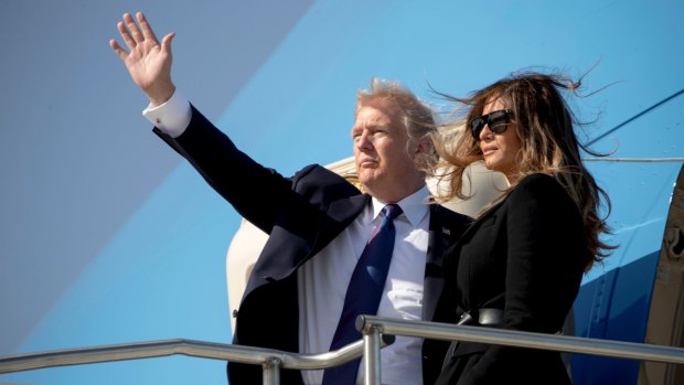 Donald Trump and first lady Melania Trump board Air Force One at Osan Air Base in Pyeongtaek, South Korea, bound for Beijing.
