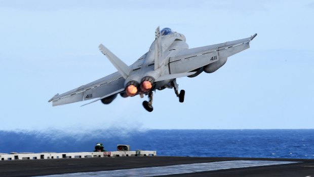 An F/A-18F Super Hornet takes off from the USS Ronald Reagan when it was in the Coral Sea earlier this week, about 650km off the Queensland coast. 