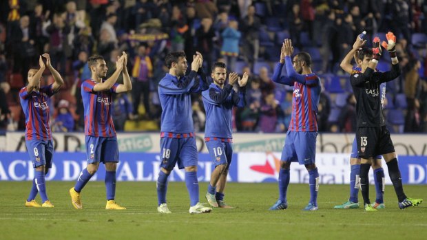 Levante's players celebrate their victory over Valencia.