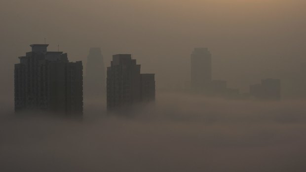 Residential buildings are seen amid heavy air pollution in Wuhan, China.