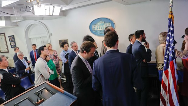 Reporters line up hoping to enter a briefing in US press secretary Sean Spicer's office at the White House on Friday.
