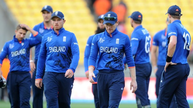 England captain Eoin Morgan leads his players off the field after their comprehensive loss to Sri Lanka.