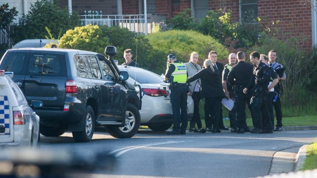 Police on Waratah Street in Doveton after the Saturday morning siege.