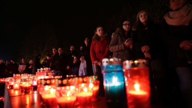 Bosnian Croat people, gather to light candles and pray for Slobodan Praljak, in southern Bosnian town of Mostar south of Sarajevo, on Wednesday.