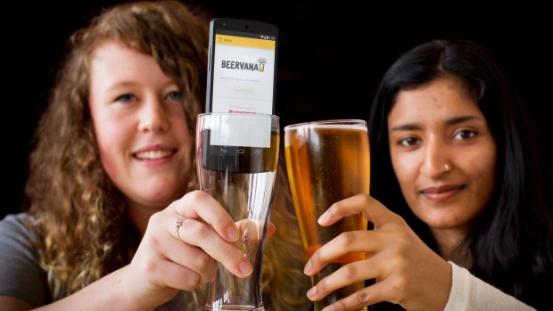 Josianne Hyson, left, and Pragya Mohan with their Beervana beer info App.