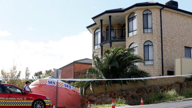 Police and State Emergency Services outside the Greenvale house on Saturday.