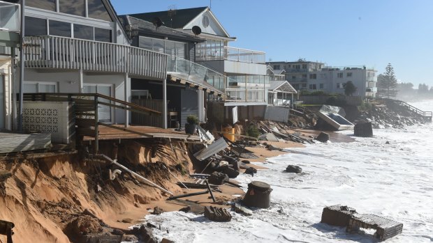 High tide begins to impact on damaged homes at Collaroy on the northern beaches of Sydney.
