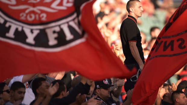 Safe haven: Wanderers fans support their team at the Christmas Eve match against Newcastle.