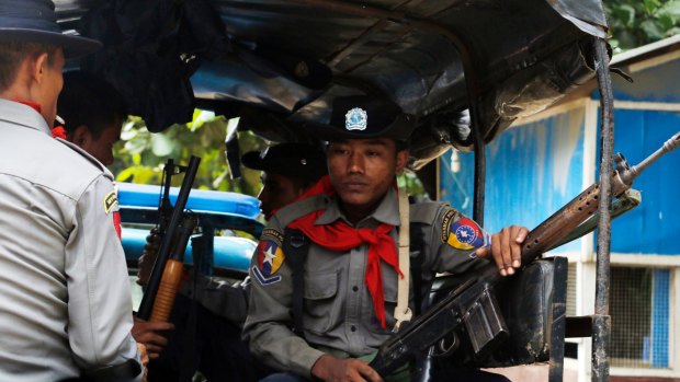 Myanmar police officers patrolling Maungdaw in Rakhine State, which neighbours  Bangladesh.