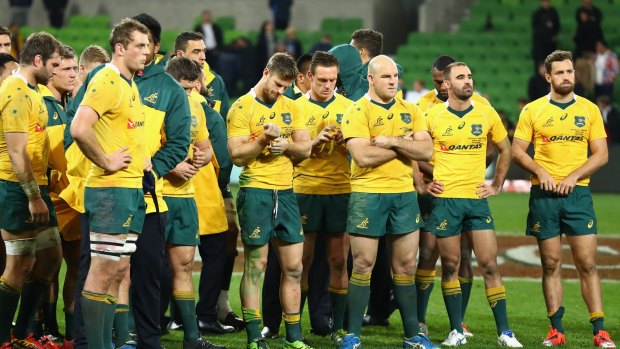 Dejected: Wallabies captain Stephen Moore and the Wallabies after they lost the Test series in Melbourne.