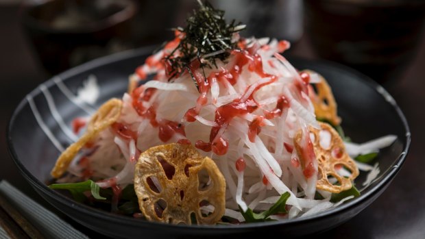 The daikon white radish salad with honey and sour plum dressing. lotus root chips and shredded seaweed. 