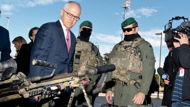 Prime Minister Malcolm Turnbull, pictured with Australian Defence Force personnel, will meet with state and territory premiers on Thursday to discuss new counter-terrorism offences.