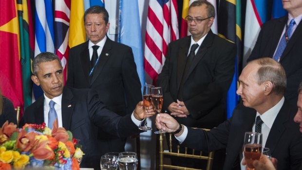Chilly relationship: US President Barack Obama, left, and Russia's President Vladimir Putin toast during a lunch hosted during the 70th annual United Nations General Assembly at UN headquarters. 