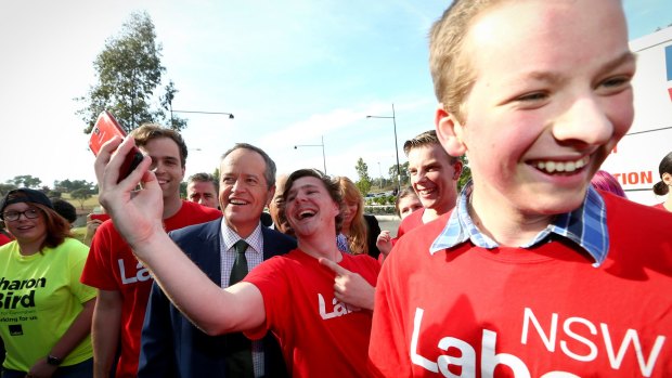 Mr Shorten poses for selfies with Labor supporters.