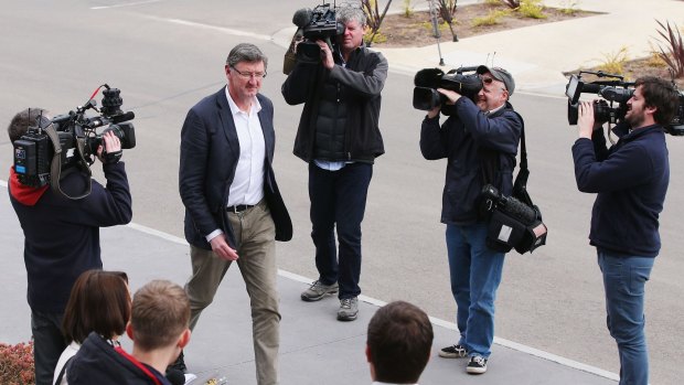 Bombers legend Simon Madden arrives at the club headquarters before James Hird announced his resignation.