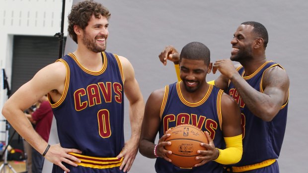 Cleveland Cavaliers stars Kevin Love, Kyrie Irving and LeBron James joke around during portraits during the NBA team's media day.