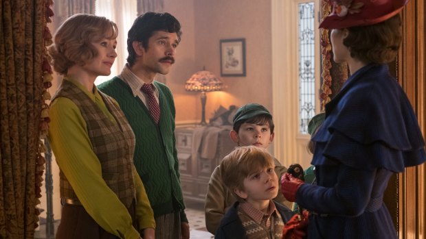 Jane (Emily Mortimer), Michael (Ben Whishaw), John (Nathanael Saleh) and Georgie (Joel Dawson) greet Mary Poppins (Emily Blunt) upon her return to the Banks' home.