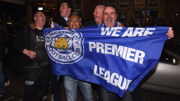 Unbelievable: Leicester City fans start what promise to be lengthy celebrations.