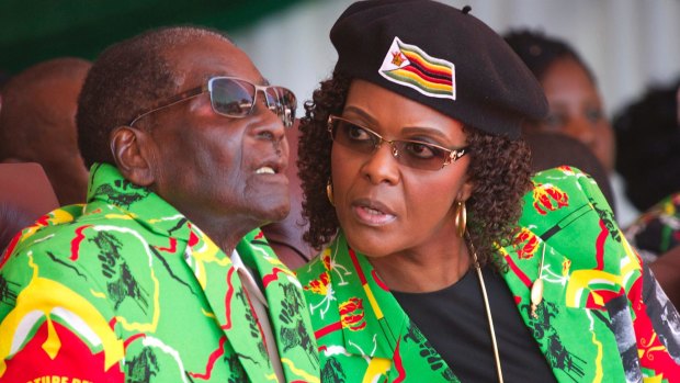 Zimbabwean President Robert Mugabe and his wife Grace at a youth rally in June.