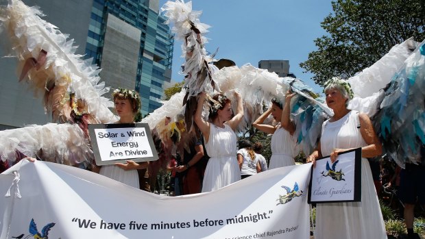 Women dressed as 'Climate Angels'.