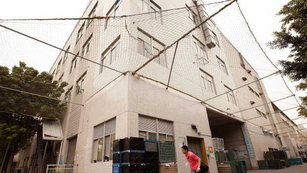 A building surrounded by safety netting at Foxconn city, in Shenzhen, China, after a spate of suicides.