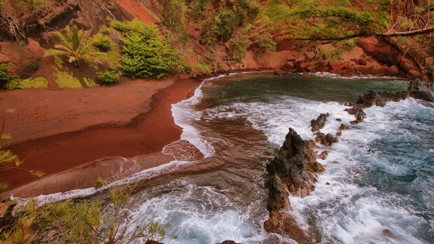 A red sand beach at Kaihalulu, east Maui, Hawaii Red. 