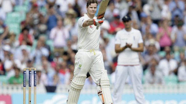 Steve Smith celebrates after reaching three figures.